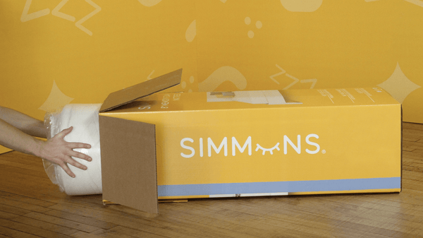 Simmons-memory-foam-mattress-being-taken-out-of-product-packaging